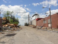 Alleyway behind Foodland grocery, showing roofing material blown behind the store ~ 456 kb